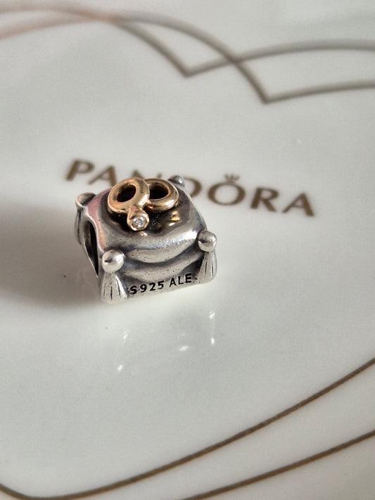 Pandora 14ct gold rings on pillow charm