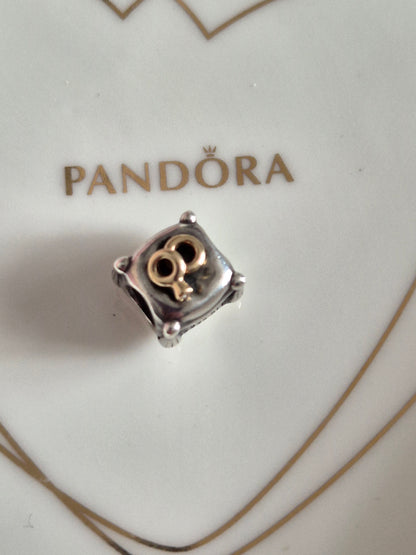 Pandora 14ct gold rings on pillow charm