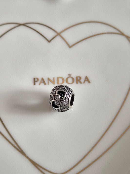 Pandora tumbling hearts charm